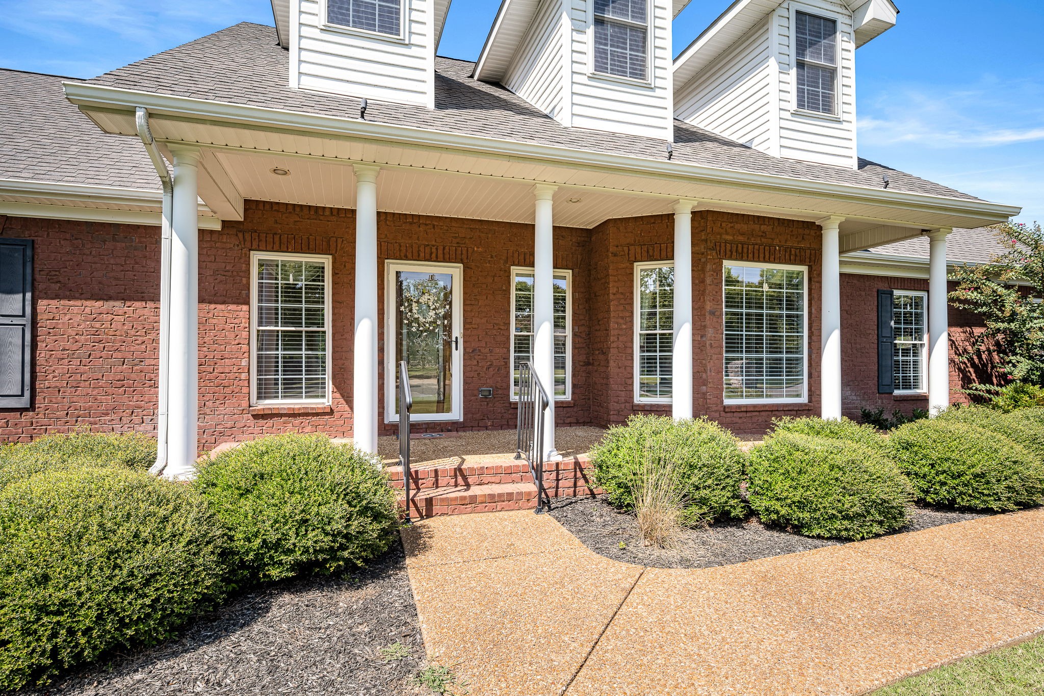 2101 Stratford Road Murfreesboro, TN 37129 - Photo 11 of 54 front view of a brick house with potted plants