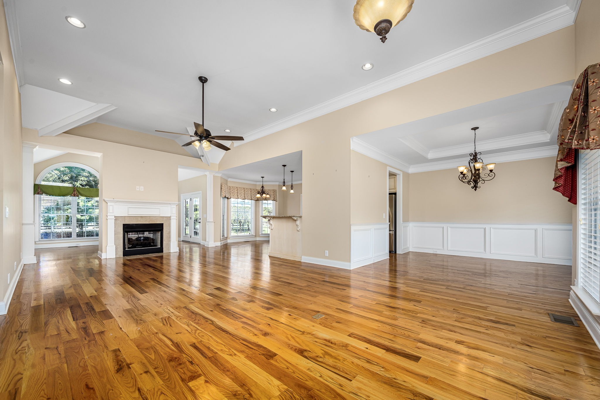2101 Stratford Road Murfreesboro, TN 37129 - Photo 16 of 54 a view of a livingroom with a fireplace a chandelier and wooden floor