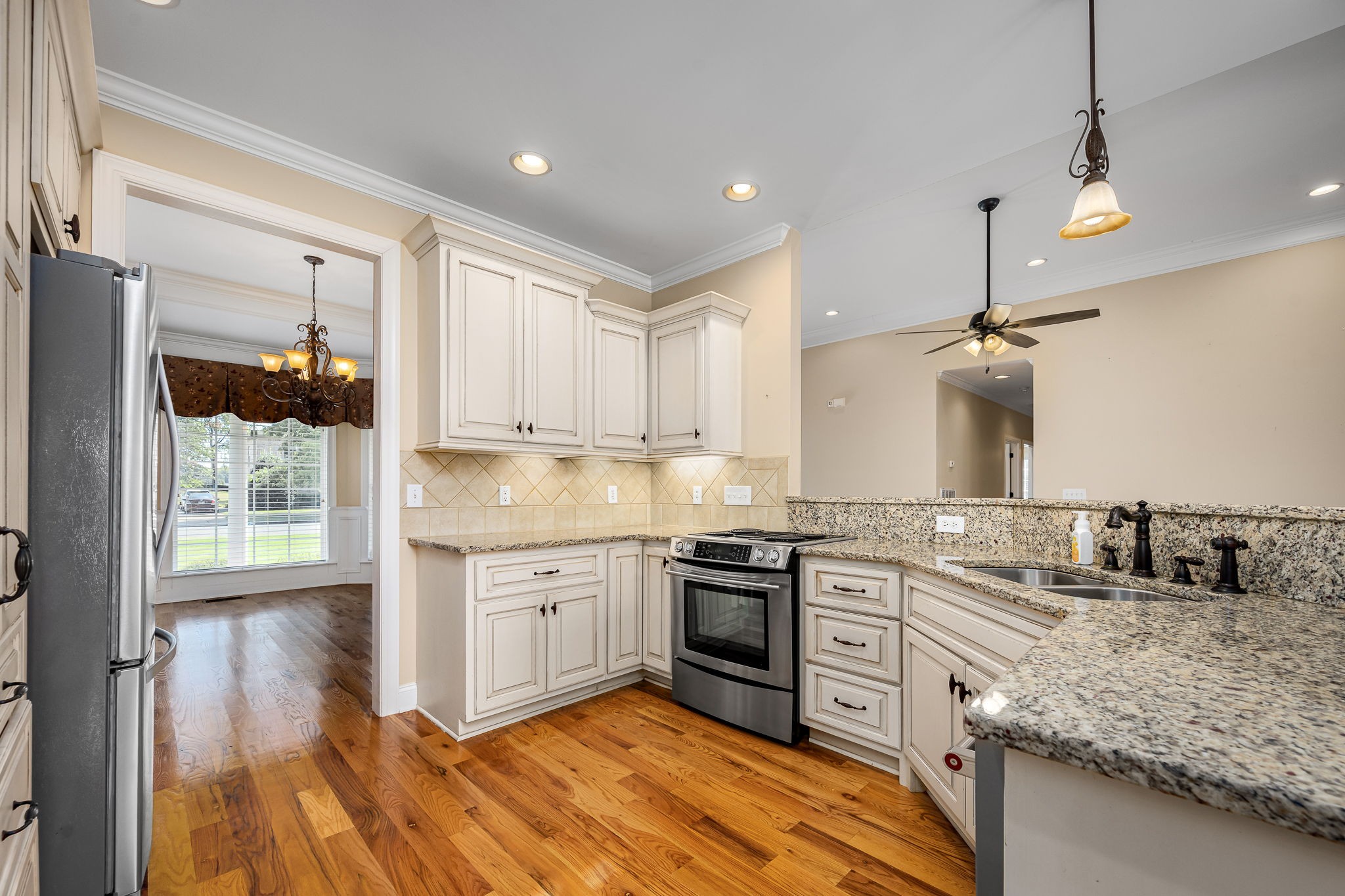 2101 Stratford Road Murfreesboro, TN 37129 - Photo 19 of 54 a kitchen with stainless steel appliances granite countertop a sink stove and refrigerator