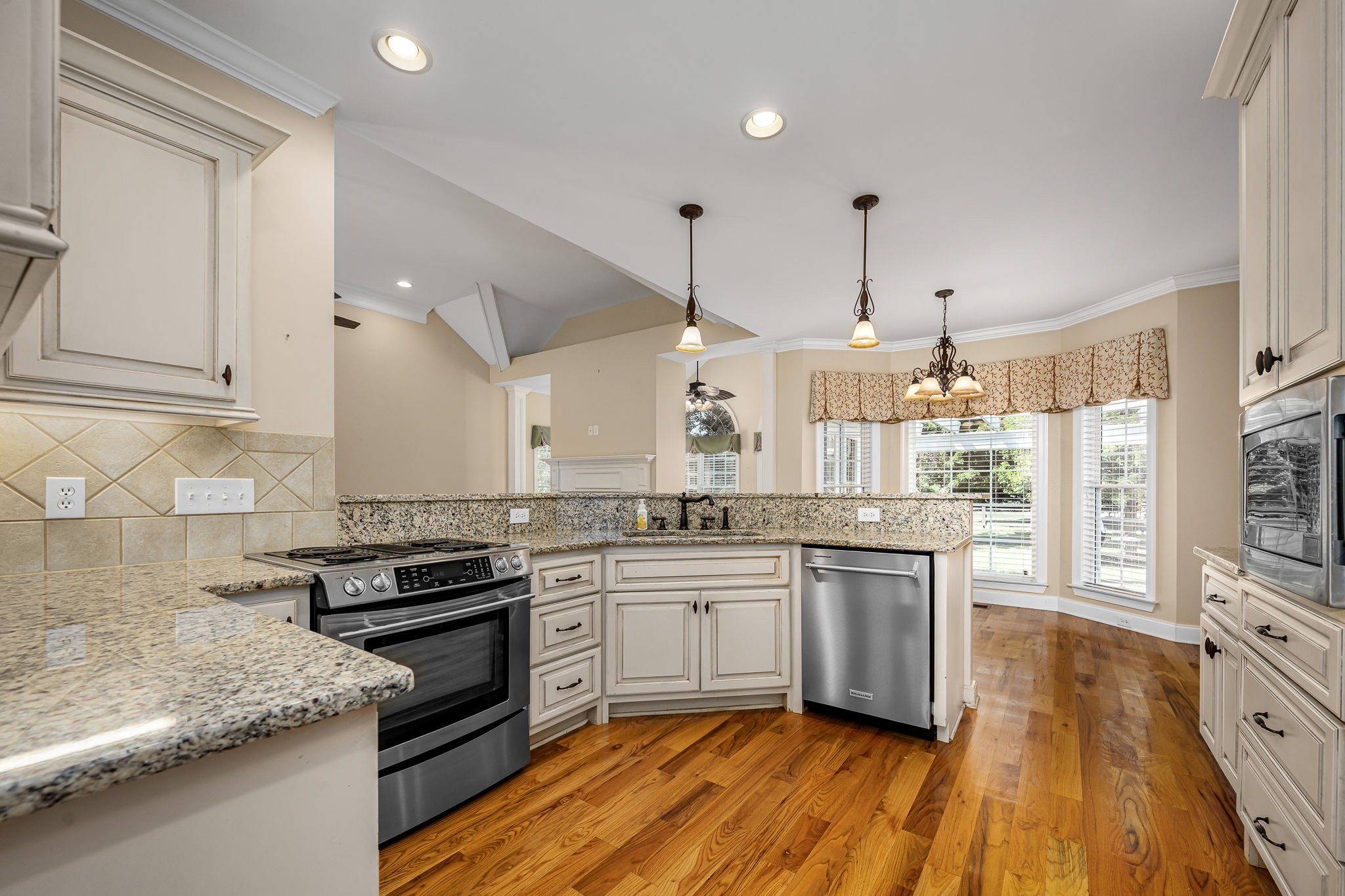 2101 Stratford Road Murfreesboro, TN 37129 - Photo 3 of 54 a kitchen with stainless steel appliances granite countertop wooden cabinets stove and sink