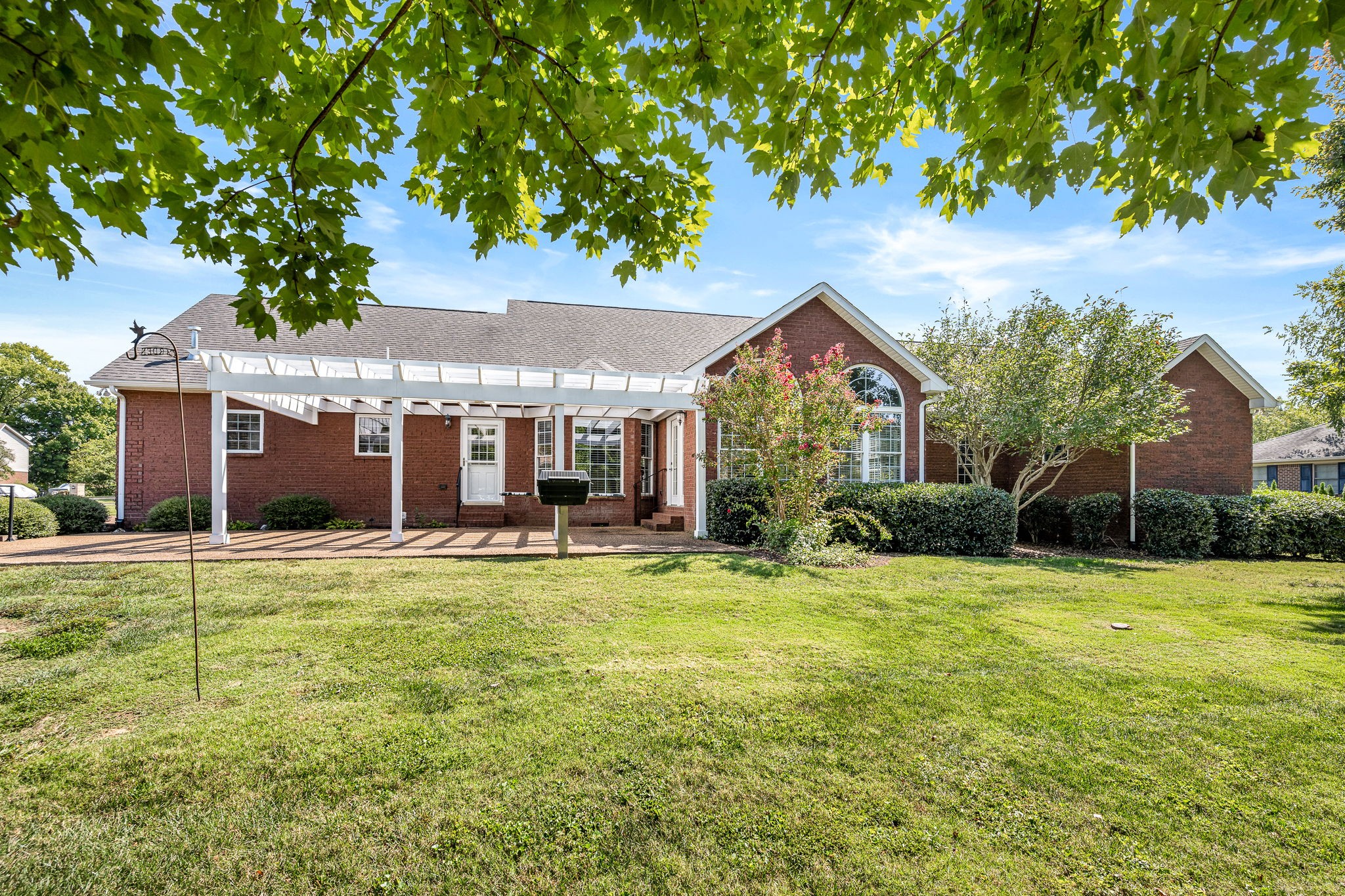 2101 Stratford Road Murfreesboro, TN 37129 - Photo 49 of 54 a front view of a house with a yard and trees