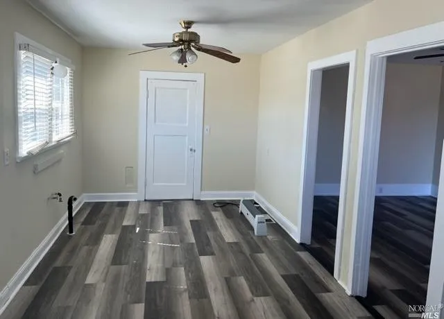 a view of an empty room with a window