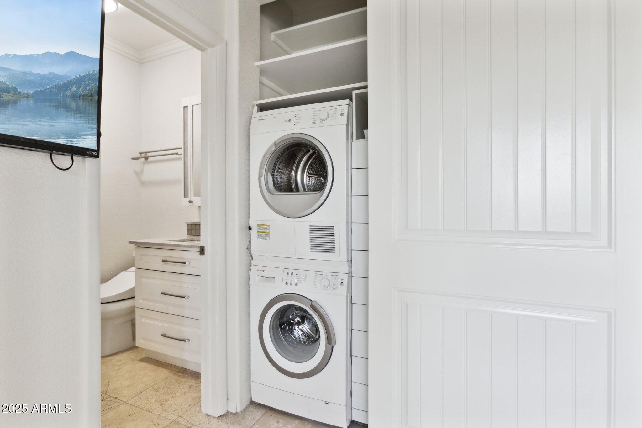 7710 East Gainey Ranch Road, Unit 229 Scottsdale, AZ 85258 - Photo 15 of 50 a utility room with dryer and washer