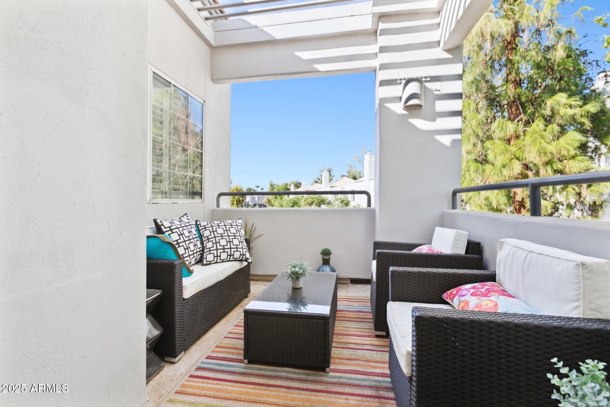 7710 East Gainey Ranch Road, Unit 229 Scottsdale, AZ 85258 - Photo 22 of 50 a living room with furniture and a window