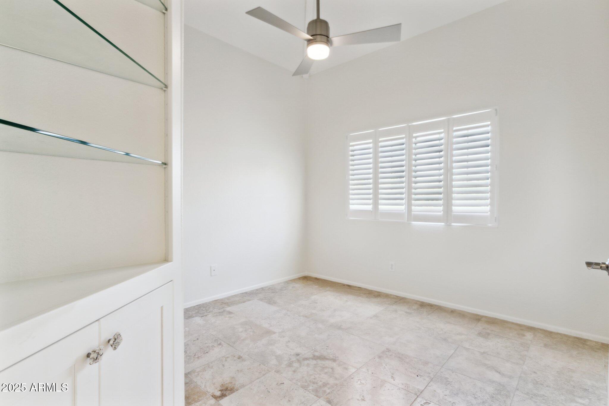 7710 East Gainey Ranch Road, Unit 229 Scottsdale, AZ 85258 - Photo 24 of 50 a view of an empty room with a window