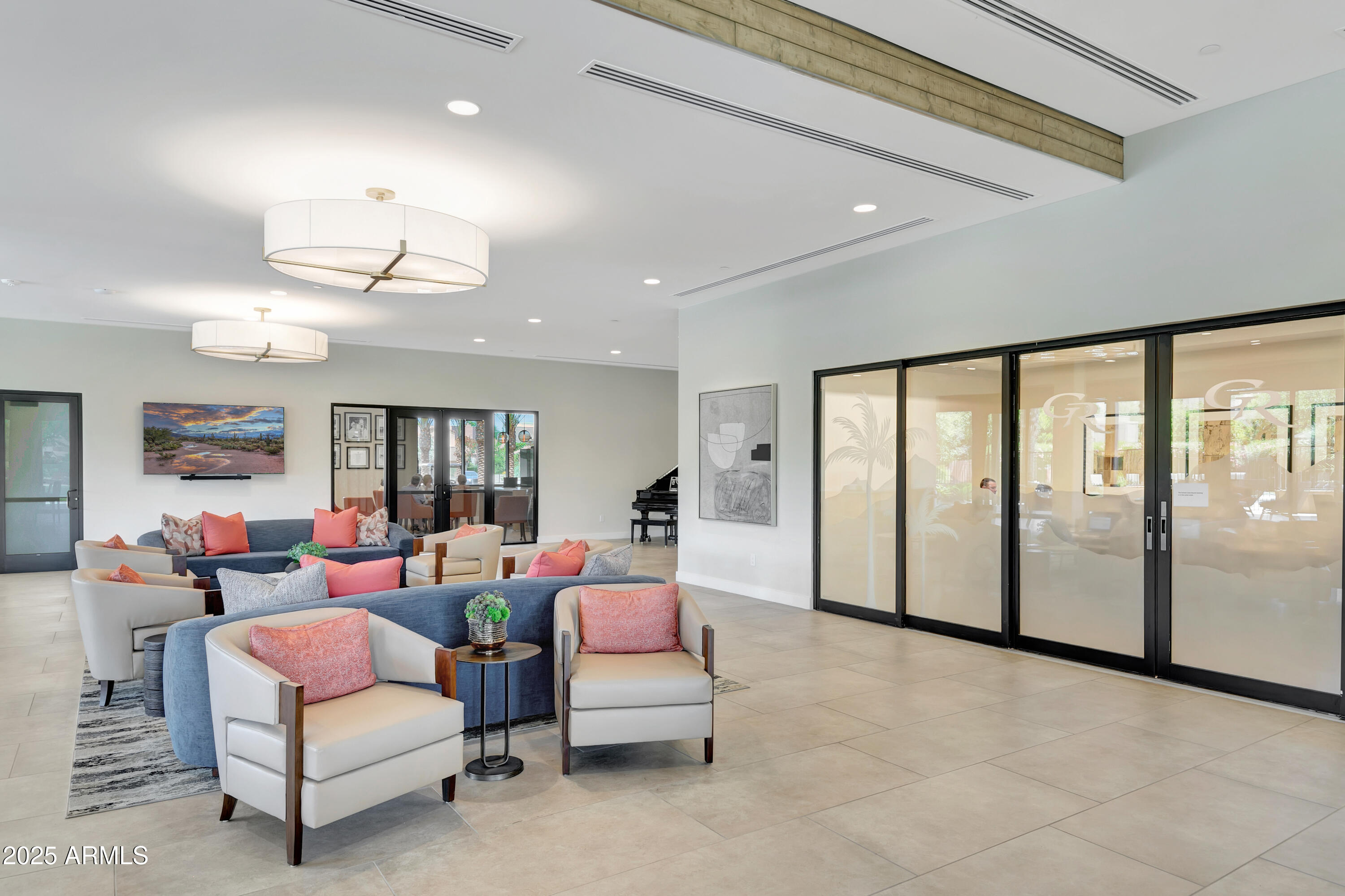 7710 East Gainey Ranch Road, Unit 229 Scottsdale, AZ 85258 - Photo 31 of 50 a living room with furniture and a chandelier