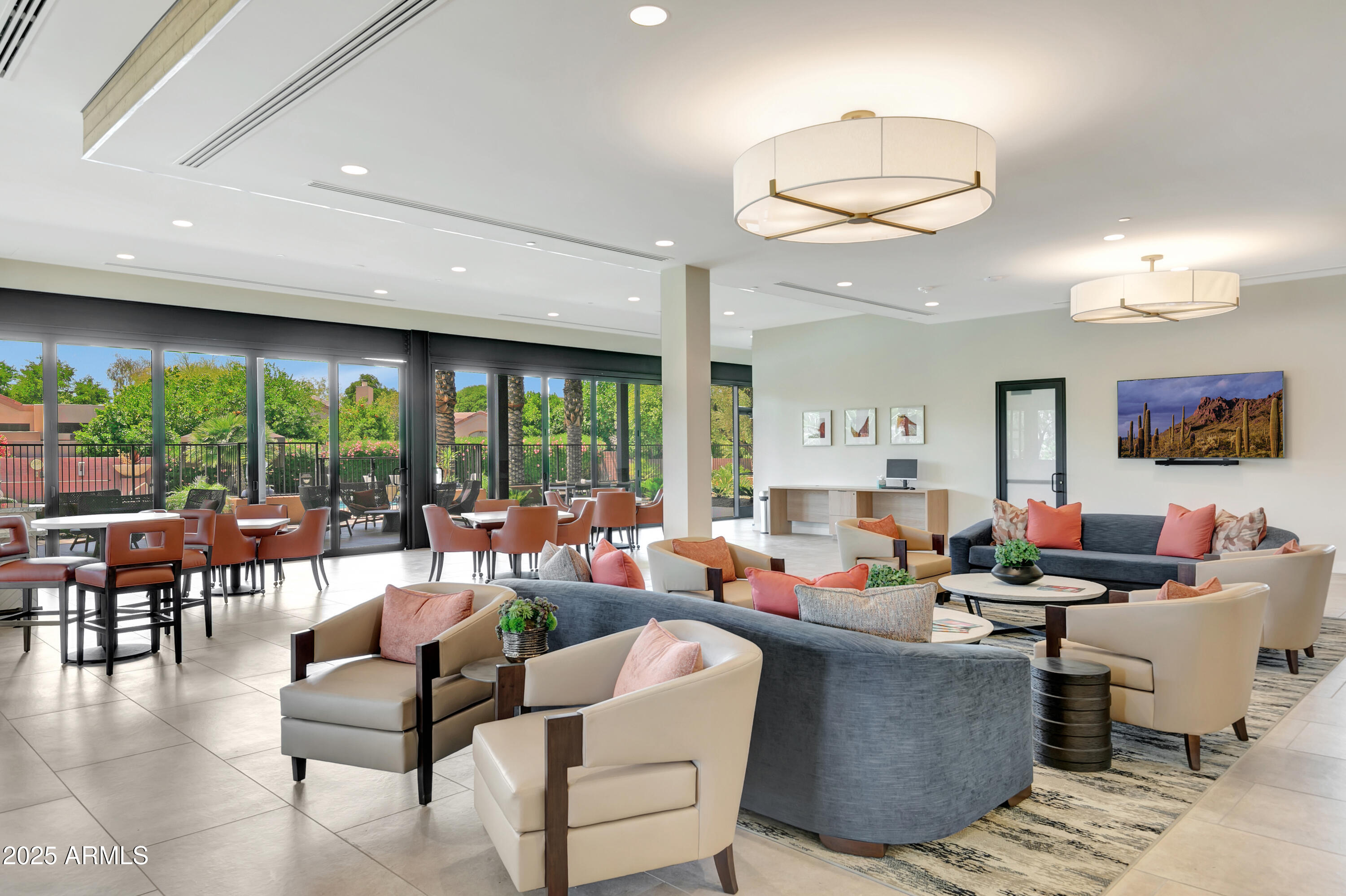7710 East Gainey Ranch Road, Unit 229 Scottsdale, AZ 85258 - Photo 32 of 50 a living room with furniture and a large window