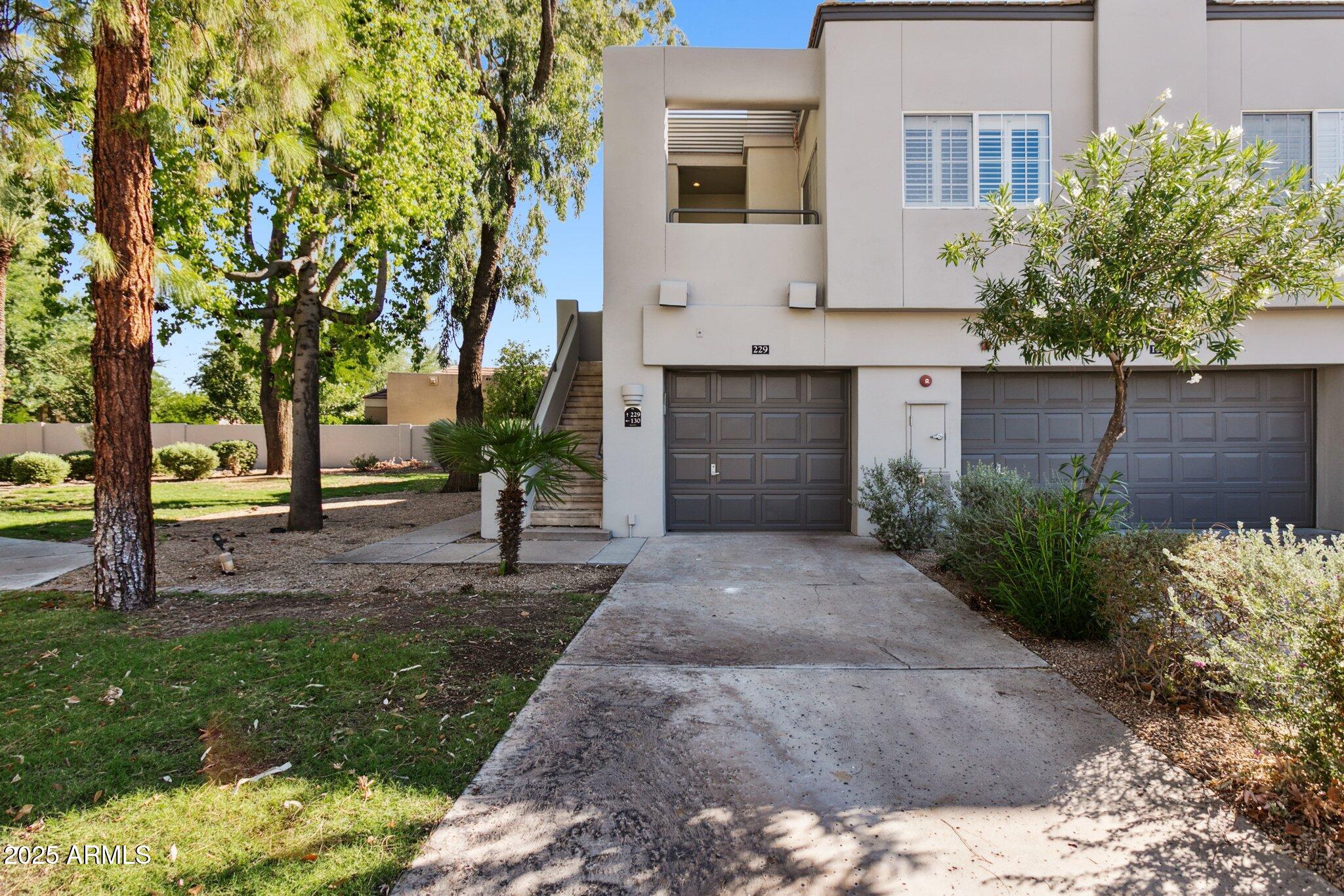 7710 East Gainey Ranch Road, Unit 229 Scottsdale, AZ 85258 - Photo 6 of 50 a view of a yard in front of a house