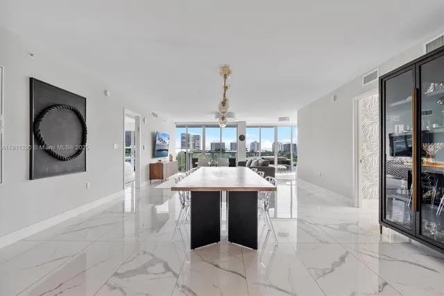 a living room with a sink and a mirror