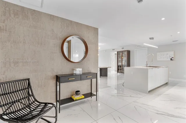 a view of kitchen with a sink and a couch