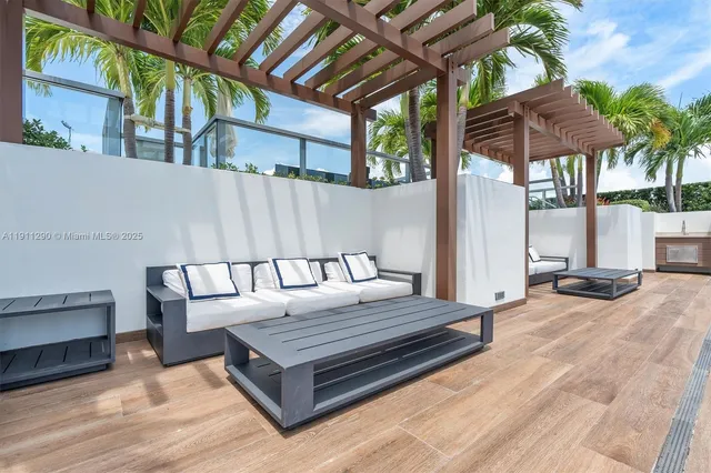 a view of a chairs and table in the patio