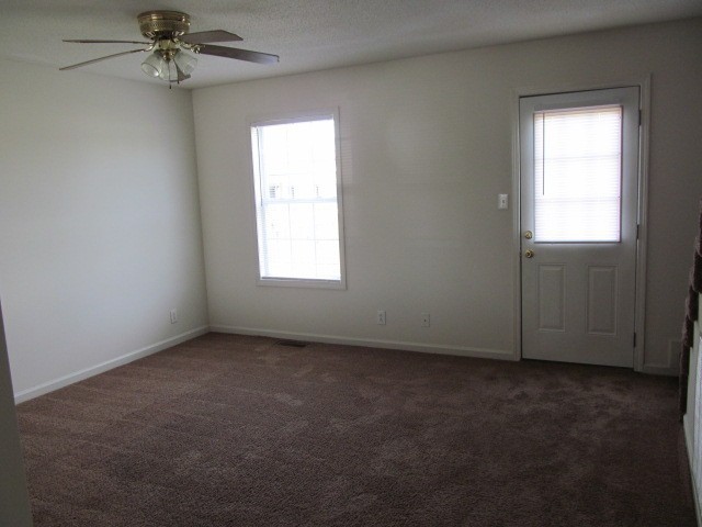 223 Tree Line Drive Oak Grove, KY 42262 - Photo 6 of 14 an empty room with a window and a fan