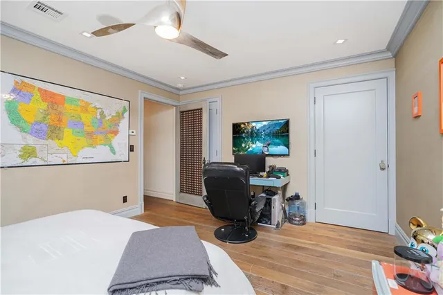 a bedroom with furniture and a window