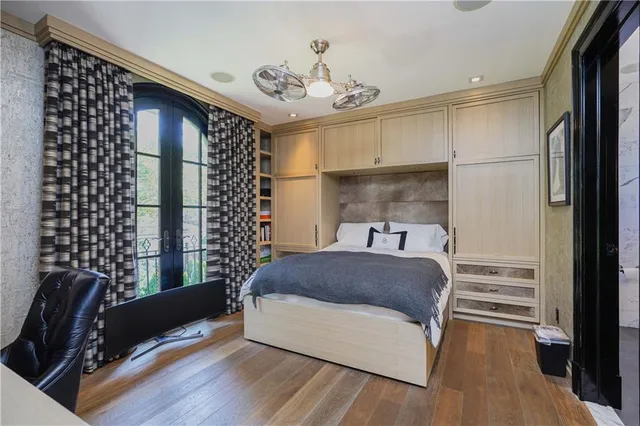 a living room with a bed furniture and a window