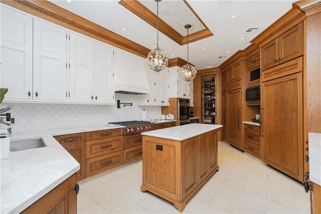 a kitchen that has a cabinets and a stove