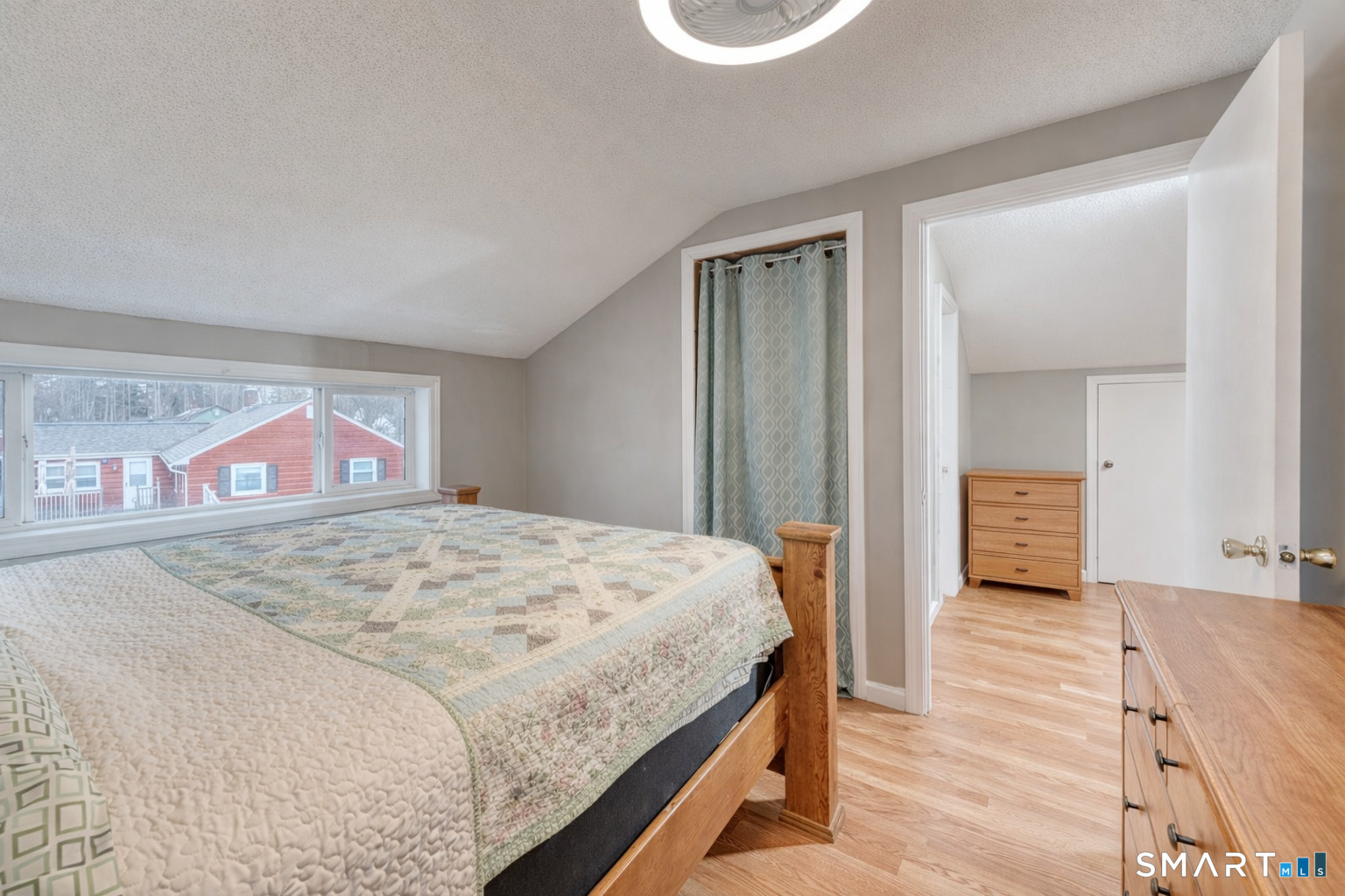 40 Cottage Grove Circle Bloomfield, CT 06002 - Photo 11 of 22 a bedroom with a bed and a mirror