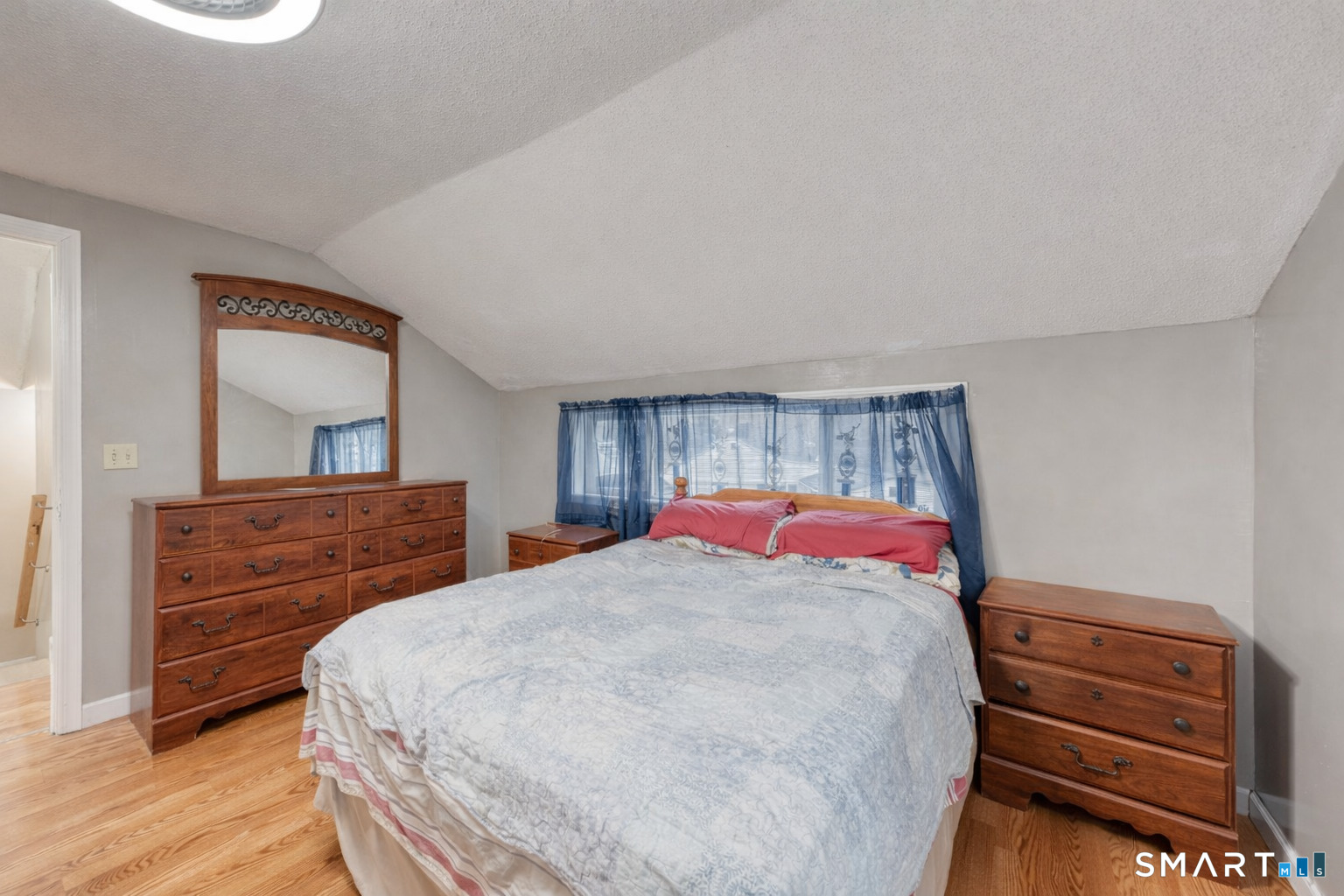 40 Cottage Grove Circle Bloomfield, CT 06002 - Photo 12 of 22 a bedroom with a bed and a dresser