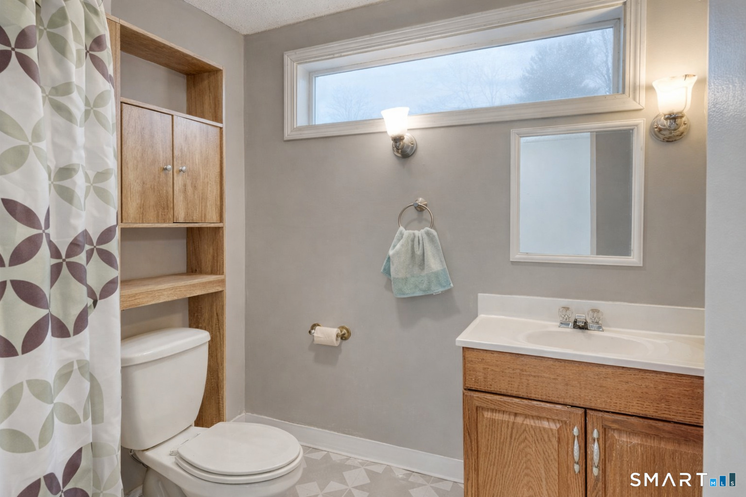 40 Cottage Grove Circle Bloomfield, CT 06002 - Photo 9 of 22 a bathroom with a sink a toilet and shower