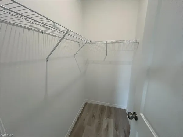 a view of a room with racks on the wall