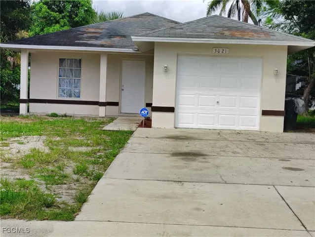 a house with yard in front of it