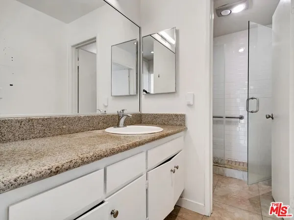 a white toilet sitting next to a bathroom shower