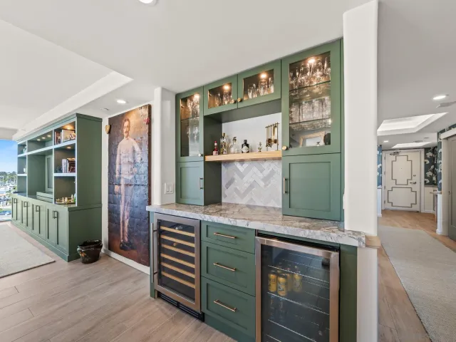 a kitchen with granite countertop a stove sink and microwave
