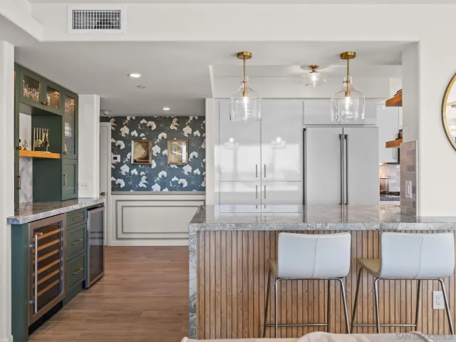 a kitchen with stainless steel appliances a sink and cabinets