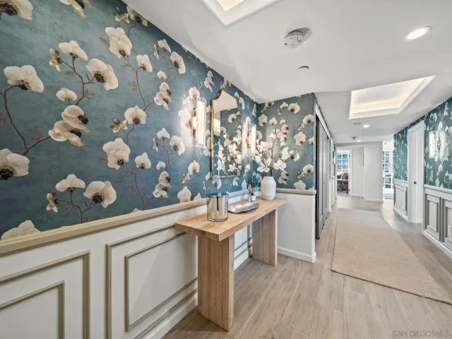 a living room filled with furniture and a potted plant