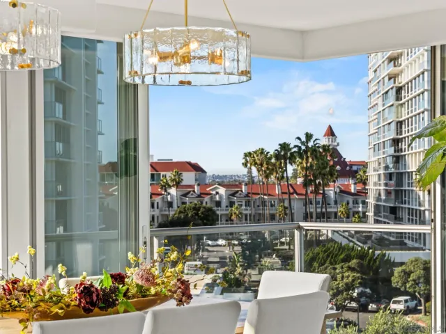 a bedroom with furniture and a floor to ceiling window