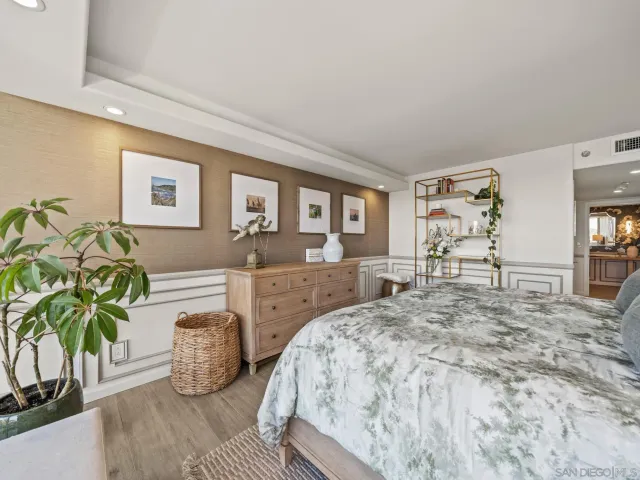 a bathroom with double vanity sink and shower