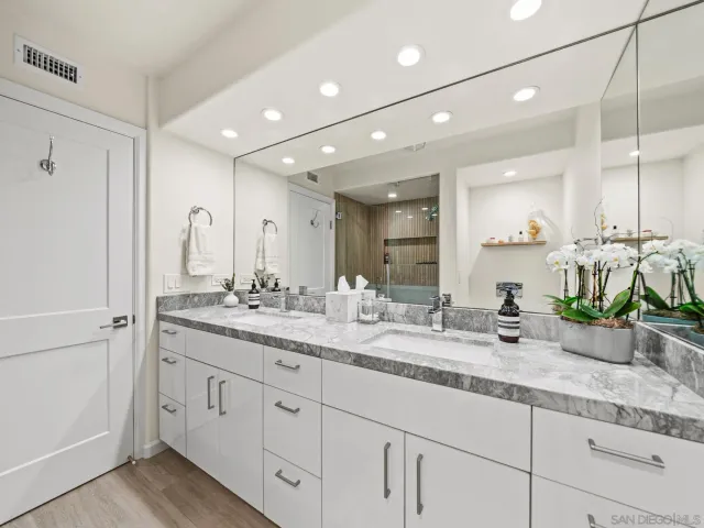 a bedroom with a bed and a night stand