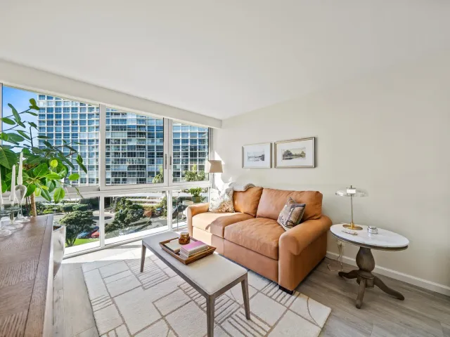 a view of a balcony with an outdoor seating