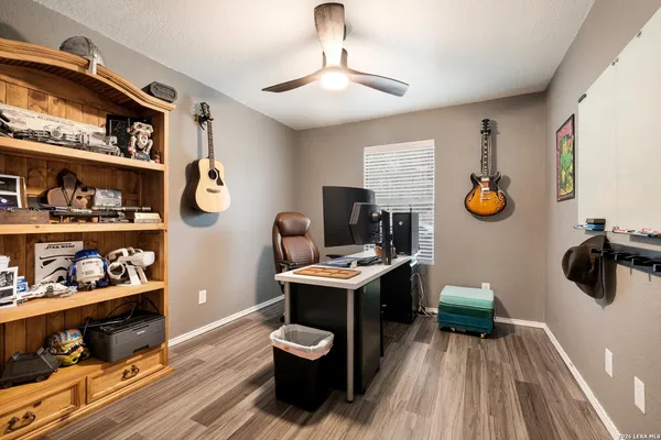 a view of workspace with wooden floor shelves