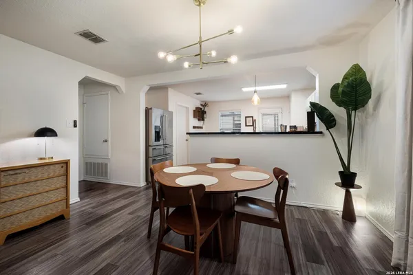 a view of a dining room with furniture and wooden floor