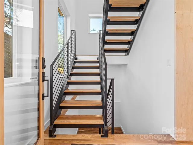 a view of entryway with wooden floor