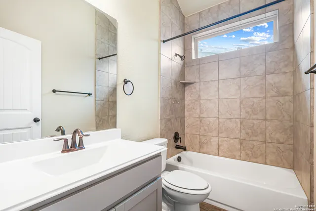 a bathroom with a sink a toilet and a bathtub