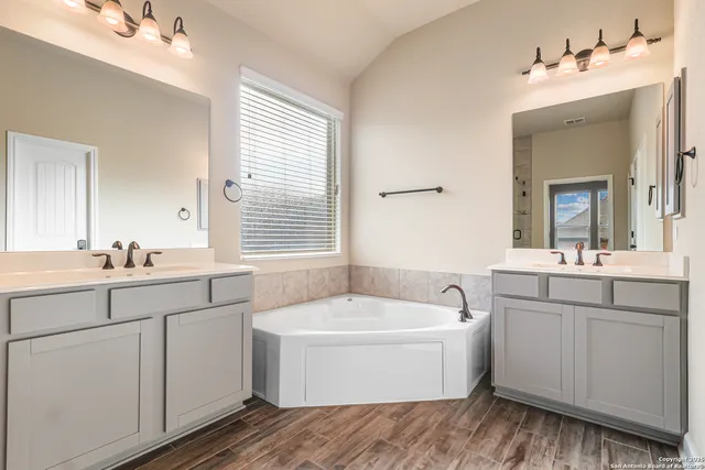 a white bath tub sitting next to a white sink
