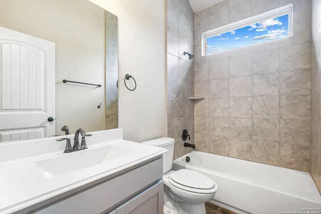 a bathroom with a sink a toilet and a bathtub