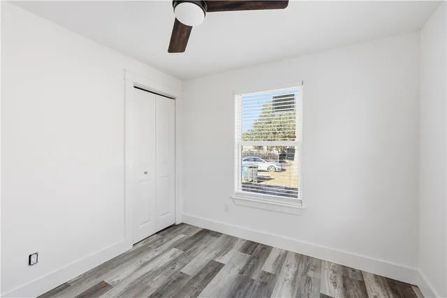 a view of an empty room with windows