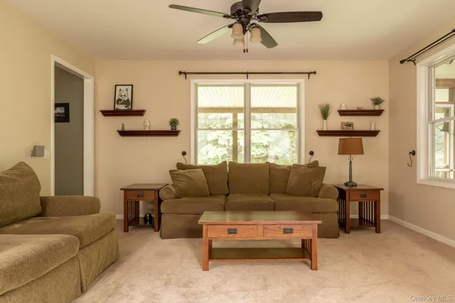 a living room with furniture and a window