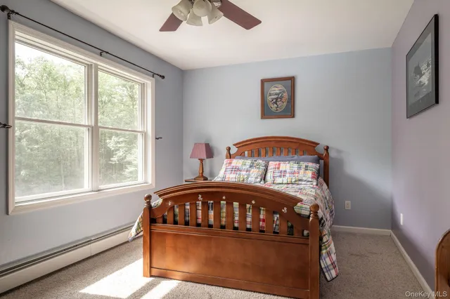 a front view of a bedroom with a large window