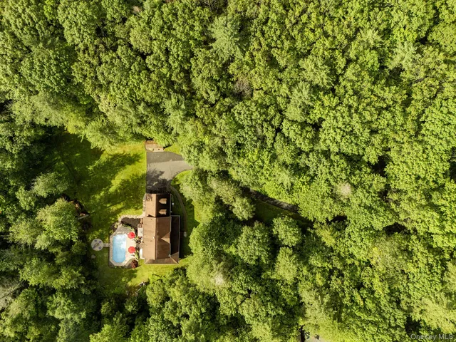 a view of a house with a tree