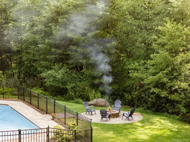 a view of a swimming pool with chairs