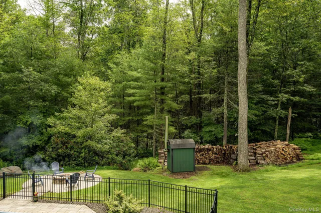 a view of a chair and table in the garden