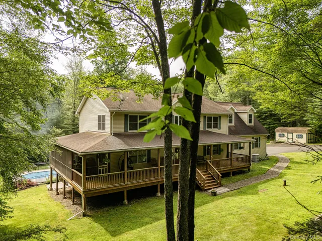a aerial view of a house with swimming pool