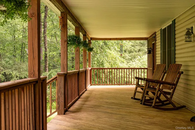 a view of a balcony with chairs