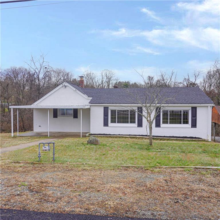 216 Roberts Road Pittsburgh, PA 15239 - Photo 1 of 17 a front view of a house with a yard