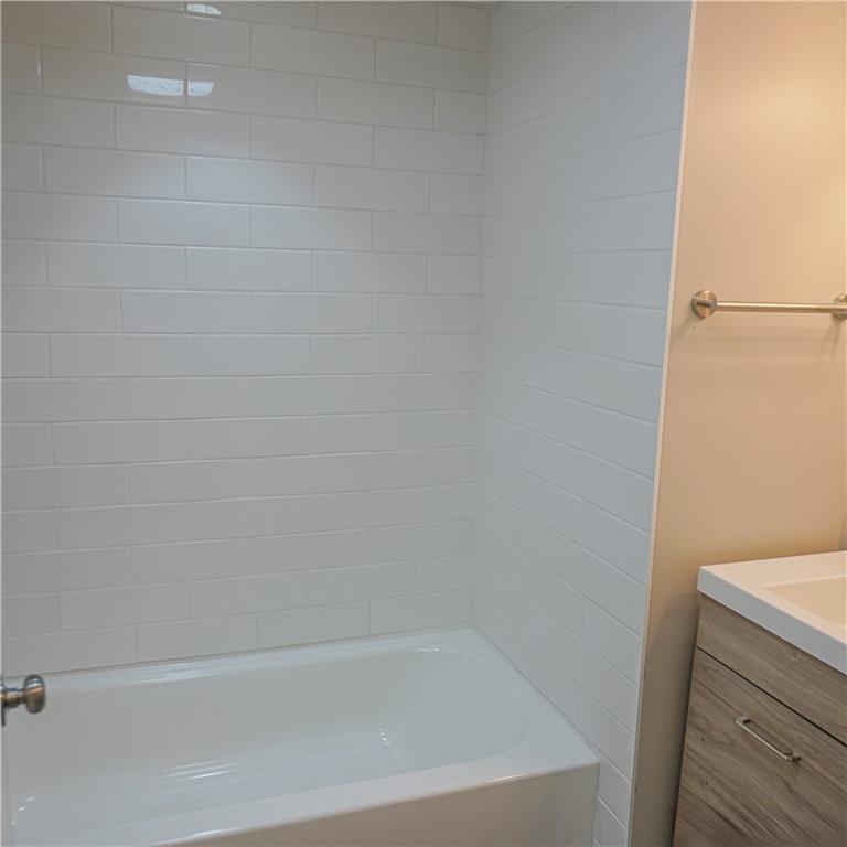 216 Roberts Road Pittsburgh, PA 15239 - Photo 11 of 17 a close up of a bathtub