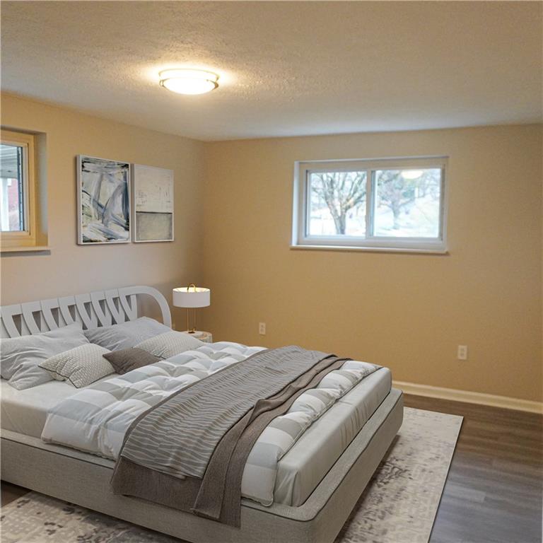 216 Roberts Road Pittsburgh, PA 15239 - Photo 9 of 17 a bedroom with a bed and a window
