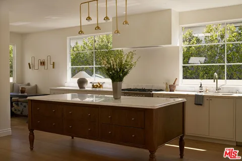 a kitchen with a sink and window